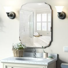 a bathroom with a sink and mirror on the wall