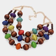 Necklace Size: 17.5" + 3.5" Decor Size: 4.5" L Earring Size: 2.25" L Multicolor Wooden Beads Jewelry, Elegant Multicolor Wooden Beads Necklaces, Multicolor Wooden Round Bead Jewelry, Multicolor Wooden Round Beads Jewelry, Multicolor Wooden Beaded Jewelry, Necklace With Large Round Beads, Brown Jewelry With Colorful Beads, Multicolor Wooden Beads Necklaces For Jewelry Making, Multicolor Wooden Beads For Jewelry Making