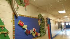 an empty hallway with christmas decorations on the wall