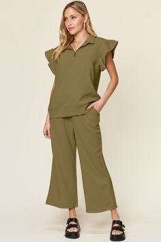 Get the best of both style and comfort with our Double Take Texture Ruffle Short Sleeve Top and Drawstring Wide Leg Pants Set. The unique texture adds dimension to this stylish ensemble, while the ruffle detail and drawstring waist provide a flattering fit. Perfect for any occasion, this set is sure to make a statement. Features: Drawstring, Pocketed Number of pieces: Two-piece Stretch: Slightly stretchy Material composition: 97% polyester, 3% spandex Care instructions: Machine wash cold. Tumble Cocktail Dress Curvy, Casual Cocktail Dress, Curvy Swimwear, Spring Sweater, Ruffled Sleeve Top, Ruffle Shorts, Bras And Panties, Short Jumpsuit, Clothing Sets