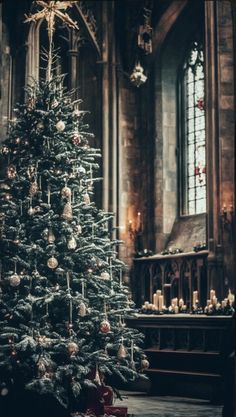 a decorated christmas tree in a church