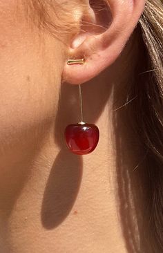 Cherry Earrings

How to style:
These earrings are a head-turner and exert confidence at any event. Style these cherry earrings with a simple dress or top and jeans, the perfect accessory!

Features:
  
 * Cherry shaped earring 
 * Gold toned hardware 
 * Poppy red acrylic cherry 
 * Ear needle drop design 
 * Acrylic cherry Cherry Red Clothes, Cherry Accessories, Tomato Girl Aesthetic, Not So Berry Challenge, Shells And Pearls, Statement Earrings Silver, Jeans Highwaist, Cherry Red Hair, Tomato Girl