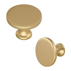 two brass knobs on white background, one is round and the other is round