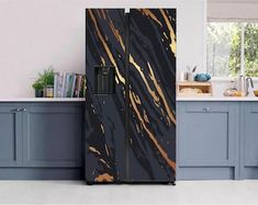 a black and gold refrigerator in a kitchen