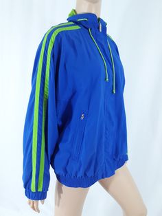 "Women's Unisex Athletic Jacket Sportswear Outerwear Blue Green Stripe Jogging Classic Excellent Condition Vintage Size M by LIZ SPORT Super cool rad! Vivid Blue with vivid green sports striped trim, inside netting and various cool details. Zippered Pockets, drawstring collar, elastic waist and cuffs, vented and oversized, zipper front and velcro closures. Men's women's unisex athletic classic jacket. Super fun! Excellent condition. High quality. Easy to wear casual chic vintage for the disco sp Blue Sportswear Track Jacket For Workout, Sporty Hooded Track Jacket For Jogging, Sporty Track Jacket For Jogging, Blue Sporty Activewear For Outdoor Activities, Moisture-wicking Blue Outerwear For Workout, Blue Moisture-wicking Outerwear For Workout, Blue Stretch Track Jacket, Blue Nylon Track Jacket For Outdoor Activities, Blue Nylon Sportswear Windbreaker