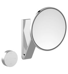 a bathroom mirror with a metal holder next to it and a round mirror on the wall