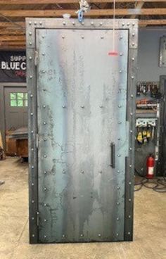 an old metal door in a garage