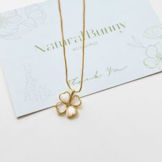 Add a touch of charm and luck to your daily wardrobe with our Four Leaf Clover Pendant Necklace. The delicate glass cat's eye stone adds a chic and simple element to this piece. Perfect for adding a little something special to your everyday look. Dimensions: 40cm+5cm Materials: 14k gold-plated brass, glass, zircon Dainty Good Luck Flower Pendant Charm Necklace, Clover Locket, Four Leaf Clover Necklace Silver, Four Leaf Clover Charm, Four Leaf Clover Locket, Cats Eye Stone, Eye Stone, Four Leaves, Four Leaf Clover