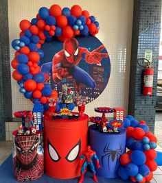 a spiderman birthday party with balloons and decorations