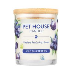 a candle with blueberries on it that reads, pet house candle freshens pet - loving homes