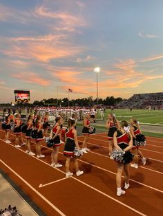 the cheerleaders are lined up on the track for their team's performance