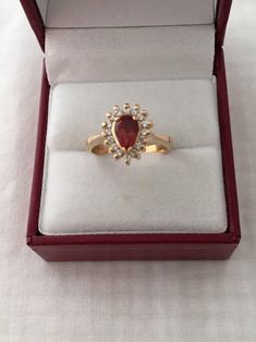 Free Shipping on orders over $35.00 however if there is a return buyer to refund seller for the free shipping cost to seller. Rare 18K Gold 0.75ct Rhodocrosite Gemstone Pear Cut 16 Accent Diamonds Solid 750 Yellow Gold Ring Stunning Beautiful 18K Gold Hallmarked 18K Ring size - 5.75 Visit our shops on Etsy HauteCoutureLaLa TrendsCouture BeautifulPatina LastingTrendsFree Shipping on orders over $35.00 however if there is a return buyer to refund seller for the free shipping cost to seller. Free S Gold Pear-shaped Cluster Ring Gift, Pear-shaped Yellow Gold Cluster Ring For Gift, Pear-shaped Cluster Ring As Gift, Formal Teardrop Ruby Ring, Formal Pear Shaped Birthstone Ring, Pear-shaped Birthstone Ring For Formal Occasions, Pear-shaped Yellow Gold Ruby Ring, Pear-shaped Birthstone Ring For Gift, Formal Pear-shaped Birthstone Ring