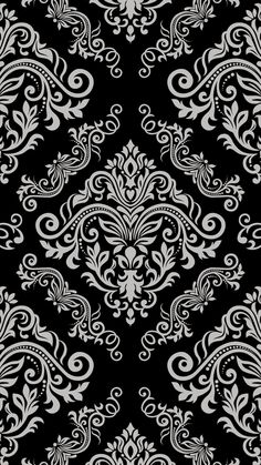 an ornate black and white wallpaper pattern