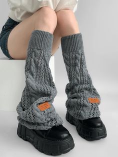 Elevate your winter wardrobe with our Gray/Black/Milk White Knit Flared Leg Warmers. Crafted from high-quality, soft knit fabric, these leg warmers are designed to provide both warmth and style. The flared design adds a touch of elegance and a retro flair, making them a perfect accessory for any outfit. Available in versatile colors of gray, black, and milk white, these leg warmers can easily be paired with skirts, dresses, or even over jeans for a chic layered look. Garment Size SizeFree SizeFu Cotton Knee-high Leg Warmers For Fall, Trendy Black Cotton Leg Warmers, Black Cotton Casual Leg Warmers, Casual Black Cotton Leg Warmers, Winter Stretch Knit Sweater, Black Knitted Leg Warmers For Fall, Gray Stretch Knitted Leg Warmers, Black Cotton Leg Warmers For Fall, Stretch Gray Knitted Leg Warmers