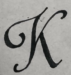 the letter k is painted with black ink