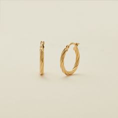 Go for the gold with the lightweight luxury of a classic pair of hoops. Featuring twisted texture and a hinge-style closure, this set of 14k solid gold earrings has that unmistakable shimmer for a finishing touch that you’ll reach for over and over again. Twisted 14k Yellow Gold Earrings, Twisted Gold Plated Yellow Gold Hoop Earrings, 14k Yellow Gold Twisted Earrings, Twisted Yellow Gold Hoop Earrings, Tarnish Resistant, Elegant Hinged Yellow Gold Huggie Earrings, Twisted 14k Yellow Gold Hoop Earrings, Modern Twist Small Hoop Earrings In Yellow Gold, Elegant Hinged Yellow Gold Hoop Earrings, Modern Twist Yellow Gold Small Hoop Earrings