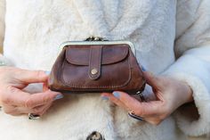 Purse with bottom zip, Front pocket, Double clip leather purse, Amy, Little coin purse, Double clasp brown purse, Ball clasp clip close purse Made of tough leather with functional print pocket Its measurements are 14cms wide, the clip is 12cms, height is 9.5, front pocket measures 9.5 x 6.5. The lining is black. Vintage Everyday Coin Purse, Brown Coin Purse With Snap Closure For Everyday, Brown Formal Coin Purse With Coin Pocket, Formal Brown Coin Purse With Coin Pocket, Everyday Brown Coin Purse With Snap Closure, Formal Brown Wallet With Zipper Pouch, Classic Brown Clutch Coin Purse, Brown Clutch Coin Purse As Gift, Brown Clutch Coin Purse Gift