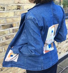 "Lovely pre-loved designer soft blue denim jacket, rescued from landfill, with added designer panels in patchwork cotton. Each panel is handmade and unique using small pieces of fabric, with a blue centre. The panels are appliquéd onto the jacket centre back and left front pocket.  The jackets has long sleeves, collar, lapels, two front pockets, and fastens with two large metal buttons. It is unisex and fits most sizes (one size). Measurements  From base of collar to back hem = 64cms Sleeve - 59 Blue Cotton Denim Jacket With Patch Pockets, Blue Cotton Denim Jacket With Patches, Blue Patchwork Cotton Denim Jacket, Fitted Recycled Denim Jacket With Pockets, Fitted Recycled Denim Outerwear With Pockets, Fitted Denim Jacket With Pockets In Recycled Denim, Relaxed Fit Denim Jacket With Patchwork, Cotton Patchwork Denim Jacket With Relaxed Fit, Fitted Patchwork Denim Jacket In Recycled Denim