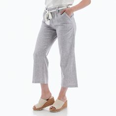 Summer has been craving the easy-going Monterey Crop Pant! Why? It starts with eco-friendly fabric made from hemp and TENCEL™ Lyocell. Together these two sustainability wonders create a lightweight and soft pant. The vintage stripe pattern, bohemian-inspired rope belt, and crop leg nod towards a beachside escape. The style pairs well with both laid-back tennis shoes or cute wedge sandals, giving you a look that can go from seaside to wine tasting in a flash. Pockets are possibly the best part - Striped Relaxed Fit Linen Bottoms, Sporty Bottoms With Three Stripes Branding, Short Length, Cotton Striped Beach Pants, Non-stretch Striped Summer Pants, Relaxed Fit Vertical Stripes Wide-leg Pants, Garment Workers, Rope Belt, Cute Wedges, Black Iris