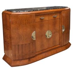 an old wooden sideboard with marble top and metal knobs on the front, isolated against a white background