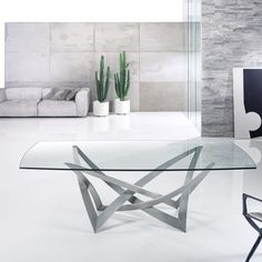 a glass table sitting in the middle of a living room