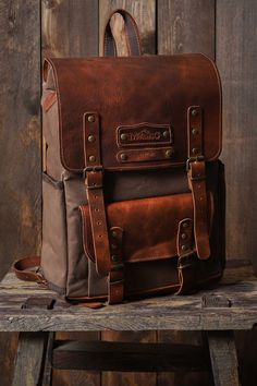 HIKI BAG*LAPTOP BACKPACK*HİKİNG BAG*BİRTHDAY GİFT*BOYFRIEND GİFT * Made of waterproof fabric and genuine leather. * Size: 17,3 H x 10,6 L x 4,3 W / 44x 27x 11cm * There are special drinkers for thermos and flask on the side of the bag. * The leather cover gives the bag an elegant look and increases its durability. *The canvas fabric, which is waxed with beeswax and paraffin to make it waterproof, creates patterns when folded and offers a rich look. * You can use and personalize this bag with con Rectangular Leather Backpack For Travel, Rectangular Coated Canvas Leather Backpack For Travel, Everyday Carry Standard Backpack With Leather Trim, Everyday Leather Trim Standard Backpack, Brown Leather Backpack With Leather Trim For Everyday Carry, Rectangular Backpack With Leather Trim And Coated Canvas, Rectangular Coated Canvas Backpack With Leather Trim, Brown Rectangular Backpack With Leather Trim, Rectangular Backpack With Leather Backing For Everyday Carry