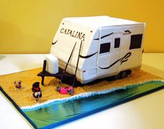 a birthday cake shaped like a camper trailer