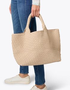 Embrace Naghedi's laid-back elegance with the best-selling St. Barths tote bag. It's expertly woven from neoprene and features a matching pouch that's perfect for toting your everyday essentials. Modern Woven Bags For On-the-go, Woven Leather Shopping Bag With Double Handle, Beige Woven Bags For On-the-go, Neutral Double Handle Bag With Rolled Handles, Neutral Bags With Rolled Double Handles, Double Handle Woven Leather Shopping Bag, On-the-go Woven Leather Tote Bag, Beige Top Handle Bag With Woven Leather, Everyday Intrecciato Weave Tote Bag