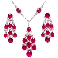 The ruby and diamond necklace and earrings chandelier set is constituted by faceted heated rubies of homogeneously brilliant quality, especially cut from larger Mozambique rough to obtain the sizes as necessary for the design. The total weight of rubies after cutting is approximately 120 carats. The total weight of diamonds is 6.12 carats. All of our diamonds are of top quality (color, clarity and cut F-VVS). The set is one-of-a-kind not only for the difficult matching/cutting of the stones, but Diamond Necklace And Earrings Set, Chandelier Set, Diamond Necklace And Earrings, Ruby Diamond Necklace, Chain Ideas, Sapphire Diamond Necklace, Ruby And Diamond Necklace, Jewel Design, Drop Necklaces