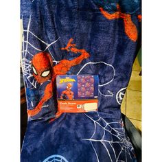 the spiderman blanket has been folded up