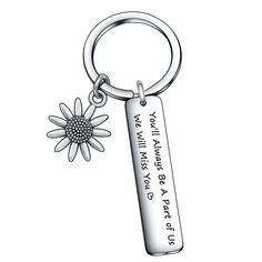 a keychain with a flower on it that says, i may always be a daisy