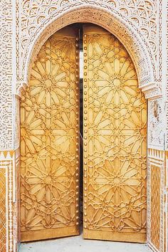 an ornate wooden door with intricate carvings on it