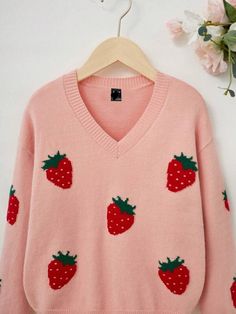 Add a dash of playful appeal to your casual wear with our Plus Size Strawberry Pattern Pullover Sweater. This sweater features a fresh fruit and vegetable pattern, with vibrant strawberry embroidery that pops against the soft pink backdrop. The V-neck design flatters the neckline, while the long sleeves and drop-shoulder cut offer a comfortable, relaxed fit. Designed with a loose outline, this pullover ensures a breezy feel with plenty of room to move. The knitwear fabric provides a slight stret Strawberry Embroidery, Comfy Jumpsuits, Strawberry Pattern, Pink Backdrop, Loose Fabric, Shoulder Cut, Cozy Sweaters, Fresh Fruit, Neck Designs