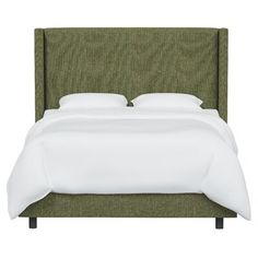 a bed with a green headboard and white sheets on it's sides, against a white background