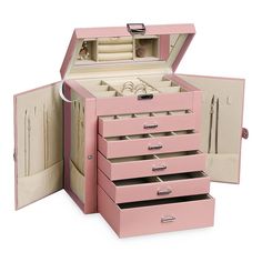 an open pink jewelry box with three drawers and two rings on the top, in front of a white background