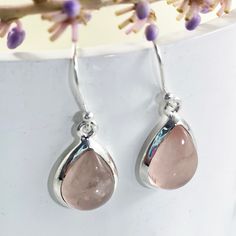 Bliss is an elegant pair of light-weight drop earrings perfect for everyday wear. Featuring high quality natural pear-cut Rose Quartz gemstones, nestled elegantly in a fine sterling silver frame, our Bliss earrings will leave you radiating with inner joy all day long. Authentic Sivalya Rose Quartz Rose Quartz: Love, Friendship, Inner Healing Hallmarked Metal: 925 Sterling Silver Gemstone Size: 15mm x 10mm Cut: Pear Cut Smooth Cabochons Feminine Teardrop Earrings For Anniversary, Sterling Silver Rose Gold Teardrop Earrings, Rose Gold Sterling Silver Teardrop Earrings, Elegant Pink Sterling Silver Teardrop Earrings, Inner Joy, Quartz Gemstones, Inner Healing, Rose Quartz Gemstone, Quartz Rose