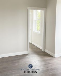 an empty room with hard wood flooring and white paint on the walls is shown