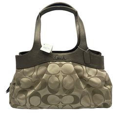 Coach Signature Lexi Shoulder Bag Features: • Khaki/Copper. Double copper brown leather handles. Roomy zipper center compartment. 2 snap closure sections. 4 inside open pockets & 1 zip inside pocket. Satin fabric lining. Size: Womens Large Measurements: Height 9 in / 23 cm Width 15.5 in / 39 cm Depth 4.5 in / 11 cm Handle Drop 9 in / 23 cm Condition: New With Tags Smoke free home. Offers Welcome! P8 Vintage Coach Bags, Copper Brown, Brown Leather Shoulder Bag, Brown Shoulder Bag, Bags Coach, Coach Shoulder Bag, Black Leather Handbags, Large Shoulder Bags, Canvas Shoulder Bag