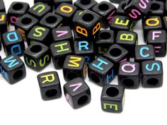 black wooden beads with multicolored letters on them