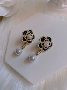 "Elegant pair of camellia flower and faux pearl drop earrings  Push black closure, length. approx. 1.5\" Colors: Black White" Black Pearl Drop Earrings For Evening, Elegant Black Flower Drop Earrings, Elegant Black Dangle Flower Earrings, Statement Pearl Earrings, Pearl Statement Earrings, Bridesmaids Earrings, Camellia Flower, Earrings Black, Bridesmaid Earrings