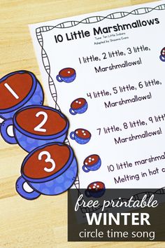 the printable winter math worksheet for little marshmallows is on top of a wooden table