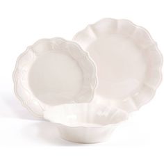 two white dishes sitting next to each other