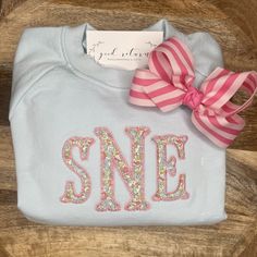 "This cozy, soft organic cotton sweatshirt is perfect for Winter and Spring, and is personalized with an applique monogram in Liberty of London fabric (as shown)!  You can also choose to put a name or initials on sweatshirt, instead of the applique monogram.  **If you choose want a Liberty fabric applique, please choose from the applique fonts in listing pics. Please also indicate what number fabric you would like for the applique.  \"SNE\" sweatshirt is in Liberty fabric #1 and dusty rose threa Appliqué Designs, Applique Fonts, Powder Blue Color, Applique Sweatshirt, Monogram Sweatshirt, Applique Monogram, Liberty Of London Fabric, Fabric Applique, Girls Wardrobe