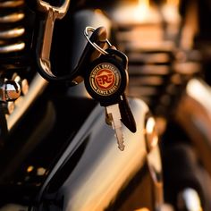 a close up of a motorcycle with a bunch of keys attached to it