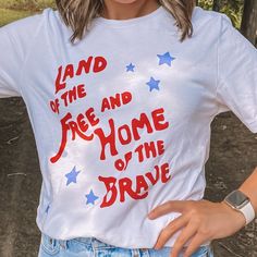 a woman wearing a t - shirt that says land of the free and home of the brave