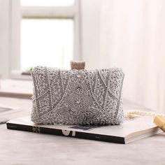 Captivating, Elegant, and Wedding-Ready – The Luxe Silver Wedding Clutch Bag is a showstopping accessory designed to elevate your bridal gown or wedding guest dress with whimsical beaded elegance. Featuring intricate silver beading and shimmering sequins, this silver wedding clutch bag exudes timeless sophistication and glamour for your most special occasions. Why We Love It...We adore the dazzling silver bead and sequin design that beautifully catches the light, adding a touch of opulence to an