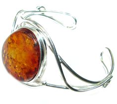 Handmade Unique 925 Sterling Silver bracelet with unique one of a kind Amber,  23.80 grams of marvelous handcrafted jewelry design. Only one piece availble ready to ship! It's unique worldwide bracelet - simply piece of art in world of fine jewelry. Vintage Design  Genuine Polish Amber .925 Sterling Silver handamde Bracelet / Cuff  BRACELET DETAILS: Weight: 23.80g; Material: Sterling Silver; Main stone: Amber; Width (widest section): L- 1 1/2, W - 1 1/8, T- 3/8 inch; Inner circumference: 6-9 inc Oval Cuff Bracelet With Polished Finish As Gift, Unique Bangle With Polished Finish, Unique Round Bangle With Polished Finish, Unique Round Cuff Bracelet With Polished Finish, Unique Oval Cuff Bracelet For Gift, Unique Handmade Oval Cuff Bracelet, Unique Adjustable Cuff Bracelet With Polished Finish, Handmade Fusion Style Sterling Silver Cuff Bracelet, Handmade Sterling Silver Fusion Cuff Bracelet