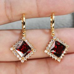 3CT Princess Cut Red Garnet Halo Drop Dangle Earrings 14k Yellow Gold Over  THIS PENDANT IS READY TO MADE A ORDER  ✔ Type : Earring  ✔ Style : Dangle Earring  ✔ Main Stone : Garnet Stone     ✔ Main Stone Color : Red ✔ Main Stone Shape :  Princess     ✔ Metal Purity : 925 Sterling Silver ✔ Main Stone Creation : Simulated ✔ Total Carat Weight : 2.50 Ct  ✔ Metal Finish  : 14k Yellow Gold Finish  ✔ Ready to Ship in 3-5 Business Days ♥ Custom Birthstone Ring ♥  The most unique jewelry you can find, p Elegant Red Dangle Jewelry, Red Drop Earrings For Valentine's Day, Red Dangle Jewelry For Formal Occasions, Formal Red Ruby Earrings, Red Classic Jewelry With Matching Earrings, Classic Red Jewelry With Matching Earrings, Red Fine Jewelry Earrings For Wedding, Red Dangle Earrings For Anniversary, Red Fine Jewelry Earrings For Party