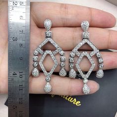 HANDCRAFTED TO PERFECTION! SPECIALLY DESIGNED! ABSOLUTELY Art Deco, GEOMETRIC, CHANDELIER EARRINGS. WITH OVER 178 PIECES OF PREMIUM GRADE, UNTREATED AND GENUINE F/VS QUALITY SPARKLING DIAMONDS! Perfect for every event! SET IN 18K SOLID WHITE GOLD HANDCRAFTED, CHANDELIER EARRINGS! THESE EARRINGS ARE SO BIG AND DAZZLING! EVERYBODY WON'T BE ABLE TO STOP LOOKING AT THEM! RETAIL VALUE: $8,600 DIAMONDS: 178 ROUND BRILLIANT, FULL CUT with excellent firing diamonds, weighting at 4.10 carats. ALL NATURAL Dazzling White Diamond-accent Chandelier Earrings, Luxury Drop Diamond Earrings With Elegant Design, Dazzling White Chandelier Earrings With Diamond Accents, Dazzling Diamond White Chandelier Earrings With Elegant Design, Luxury Silver Chandelier Earrings For Party, Luxury Crystal Bridal Earrings For Wedding, Exquisite Diamond White Chandelier Earrings, Luxury Diamond Cut Earrings For Wedding, Luxury Hand Set Drop Bridal Earrings