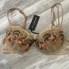 In New Excellent Condition Beautiful Bra With Scrolls And Floral Pattern On Cups. Bra Is Lined And Does Have Removable Pads. Back And Sides Are Sheer. Very Intricate Embroidered Design Around Cups And Extremely Beautiful And Quality. Very Delicate Lace Like. Made In Romania And A Luxury European Brand That Is Hard To Find Here In The United States. Fitted Floral Embroidery Bra, Floral Bra, Made In Romania, Beautiful Bra, Embroidered Design, Tan Brown, Romania, Women's Intimates, Floral Pattern